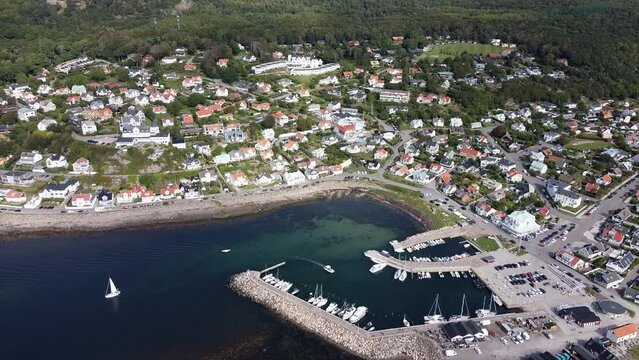 Aerial view of Molle, Sweden in the summer, showing a marina and boats.