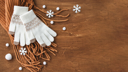 雪が降る冬に寒さ対策、手袋とマフラー背景