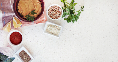 Hummus spread, made from cooked and smashed chickpeas, tahini, olive oil, garlic, lemon juice, and...