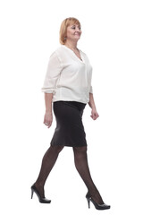 Fototapeta premium in full growth. smiling business woman striding forward .