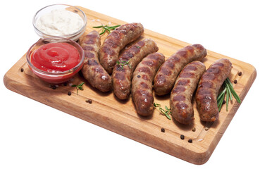 Grilled sausages on wooden cutting board