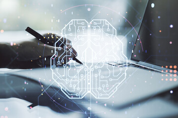 Double exposure of creative artificial Intelligence symbol with hand writing in notebook on...