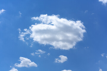 Naklejka na ściany i meble Clear blue sky background with white clouds
