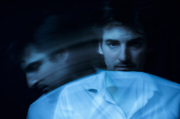 abstract blurry portrait of a man with mental and depressive illness with bipolar disorder