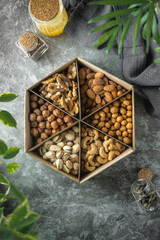 a set of nuts. a healthy snack. peanuts, pistachios, walnuts, macadamia, raisins