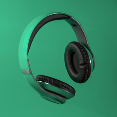 Headphones on green background. copy space