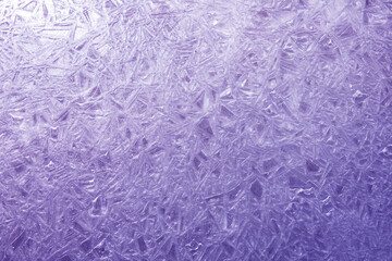 The texture of the ice surface. Winter background, festive background in the form of ice crystals, ice background for New Year's card.