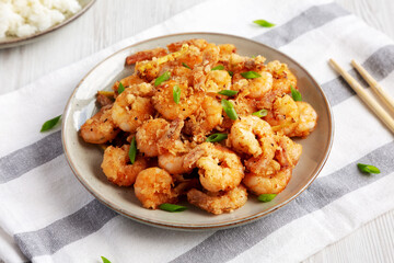 Homemade Crispy Salt and Pepper Shrimp with Scallions on a Plate, side view.