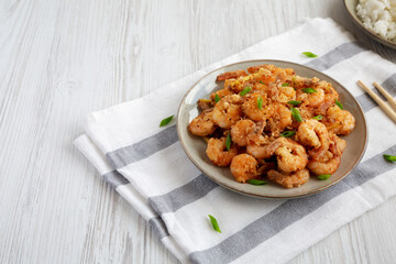 Homemade Crispy Salt and Pepper Shrimp with Scallions on a Plate, side view.
