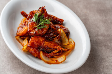 shrimp with butter sauce (Indonesia : udang saus mentega). Plating on white plate