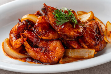 shrimp with butter sauce (Indonesia : udang saus mentega). Plating on white plate
