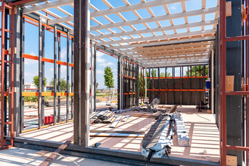Metal frame of newly built building. Construction of a new tiny house - obrazy, fototapety, plakaty