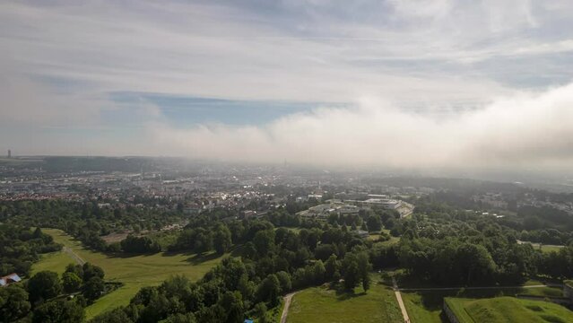 Aerial time lapse shot of Kuhberg schools, Weststadt, inner city and Ulm Minster on a cloudy but sunny morning in summer