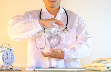 Cardiologist doctors use a virtual interface to examine the patient's heart functions and blood vessels. Medical technology and healthcare treatment to diagnose heart disorders.