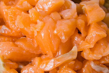 Appetizing pieces of red fish lightly salted salmon close-up macro.