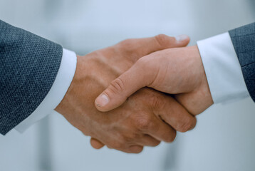 close up.handshake of business people on blurred background