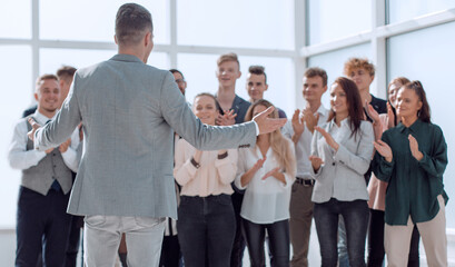 project Manager and a group of young professionals standing in the spacious lobby