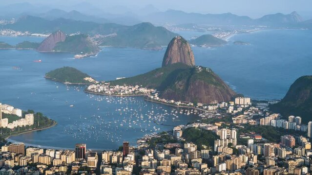 Zoom in time lapse view Sugarloaf mountain and Rio cityscape during summer in Rio de Janeiro, Brazil.	
