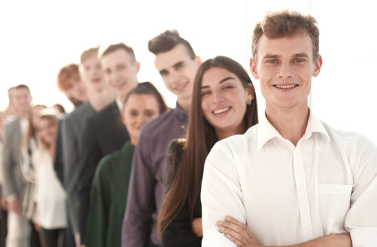 image of a group of young people standing in a queue