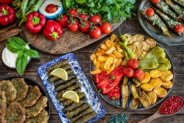 Many meals in the plates like kızartma , fritter and dolma with top view 