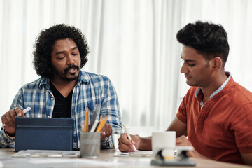 Product Manager and Developer Discussing Project