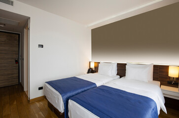 Fototapeta na wymiar Interior of a double bed hotel bedroom