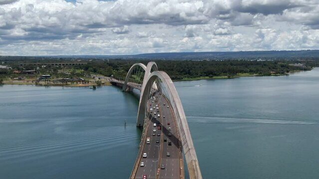 Aerial view of traffic on JK Bridge (Portuguese: Ponte JK ), a steel and concrete arch bridge across Lake Paranoa in Brasilia, Federal District, capital of Brazil.	
