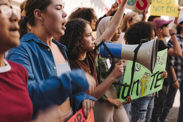 Diverse young people fighting for climate justice in the city - obrazy, fototapety, plakaty
