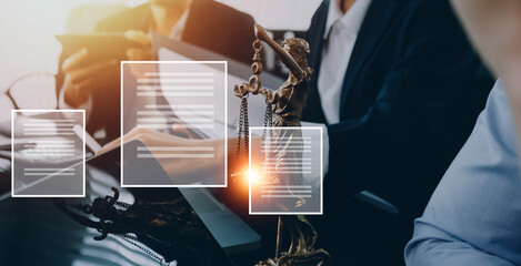Justice and law concept.Male judge in a courtroom with the gavel, working with, computer and docking keyboard, eyeglasses, on table in morning light