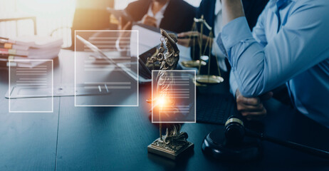 Justice and law concept.Male judge in a courtroom with the gavel, working with, computer and docking keyboard, eyeglasses, on table in morning light