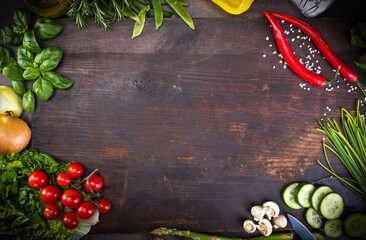 Fresh raw vegetable, herbs, on a rustic wood board. Healthy cooking composition, food frame,...