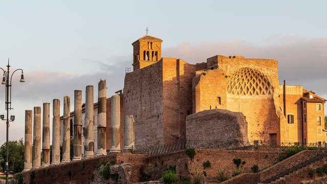Time lapse video with moving clouds at sunrise above the Domus Aurea, built by Emperor Nero in Rome, in the Roman Forum.