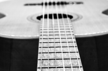 Obraz premium closeup classical guitar isolated on a black and white background