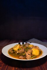 Meat stew on your plate on a wooden background. world food day concept.