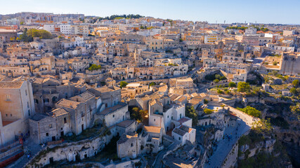 Fototapeta premium Aerial view on the Sassi di Matera, located in Basilicata, Italy. They represent the historic center of the city and are a World Heritage Site. They are rupestrian architectures carved into the rock.