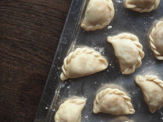 top view raw mini curry puff on tray