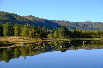 Lake, trees and mountains in Autumn, Geilo, Norway