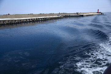 Fototapeta na wymiar the snow-covered breakwater from Abashiri Port