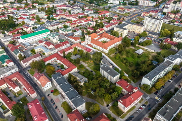 aerial panoramic view from great height on red roofs of historical center of old big city