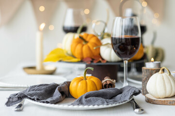 Idea for a beautiful autumn setting for thanksgiving family dinner or wedding. Orange pumpkin as...