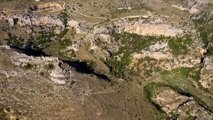 Panoramic view on the Gravina di Matera in Basilicata, Italy. The ravines are erosive incisions similar to canyons found in the province of Matera and are typical karst morphologies of the Murgia.