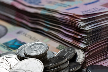 heap of different Ukrainian hryvnia in isolated background