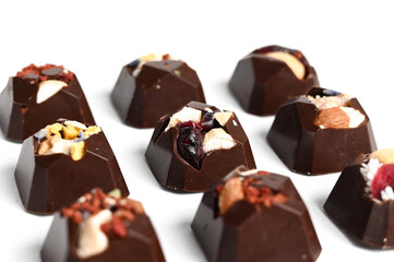 Set of healthy handmade chocolate candies isolated on white. Sweet gift. Natural diet vegetarian sweets