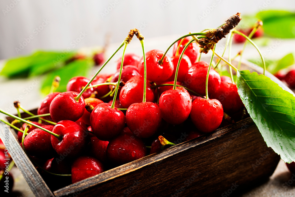 Sticker fresh cherries in bowl on table