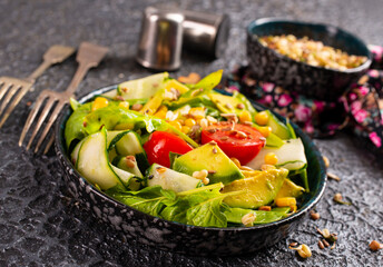 avocado, tomato and cucumber salad. Healthy vegan food. selective focus