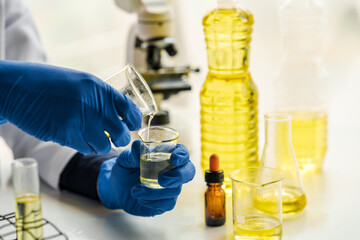 Cooking oil lab test , Quality control of vegetable oil industry products concept.