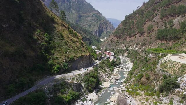 Drone Shot of a small road and river in Himachal Pradesh near Manali, Kasol