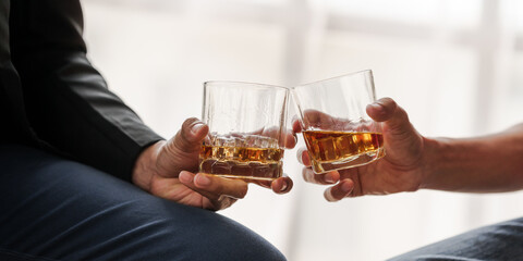 Sad depressed addicted drunk guy, Alone asian man drinker alcoholic sitting at bar counter with glass drinking whiskey. with friends.