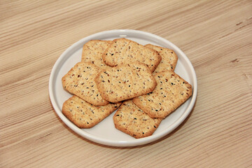 dry square crackers with black cumin seeds and quinoa for dietary nutrition