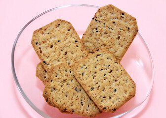dry square crackers with black cumin seeds and quinoa for dietary nutrition